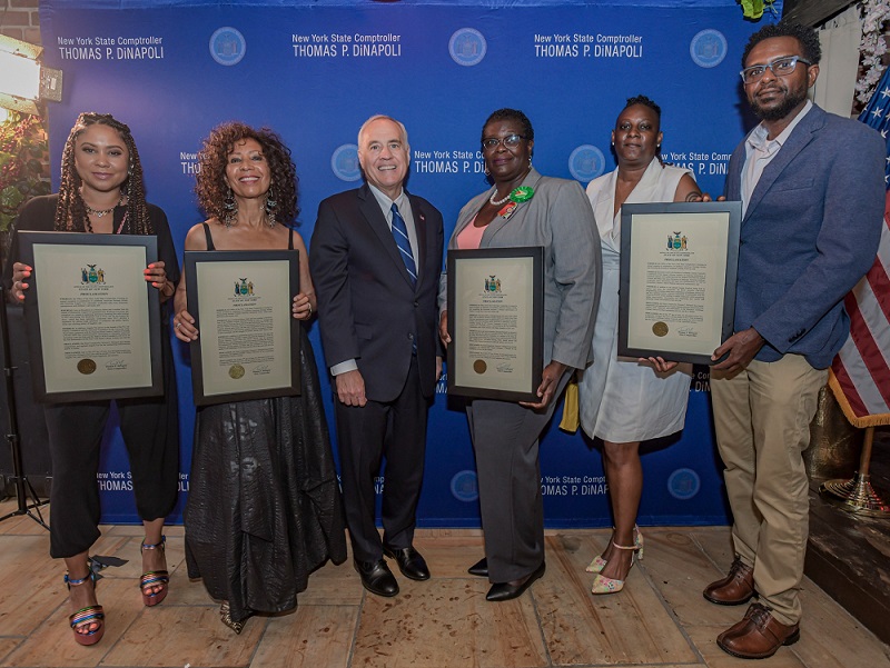 Comptroller DiNapoli standing next to the honorees of his 2022 Caribbean Heritage Celebration