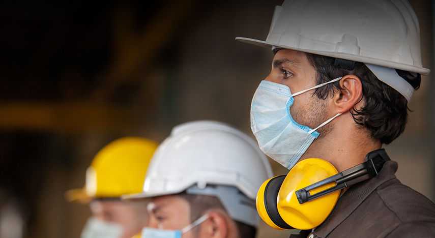 Construction workers wearing face masks.