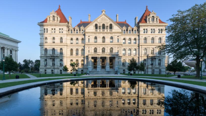 New York State Capitol Building and it’s reflection from West Capitol park in Albany, New York.