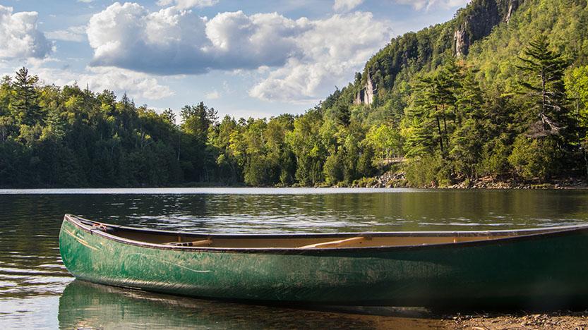 An empty canoe on a lake