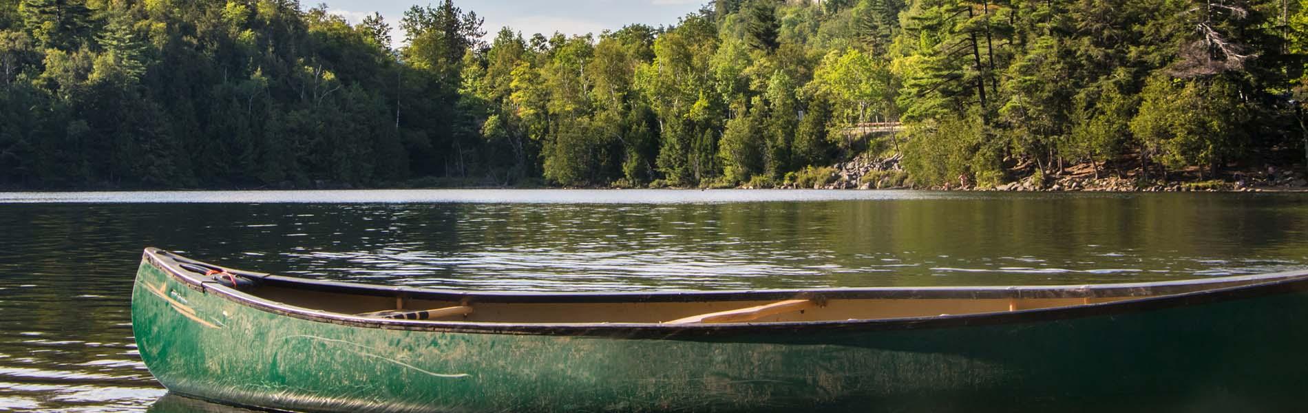 Empty canoe on a lake.